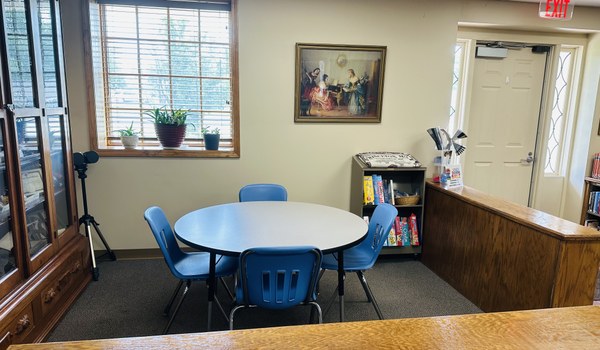 Library area with tables and chairs for games or studying. Library area with tables and chairs for games or studying.